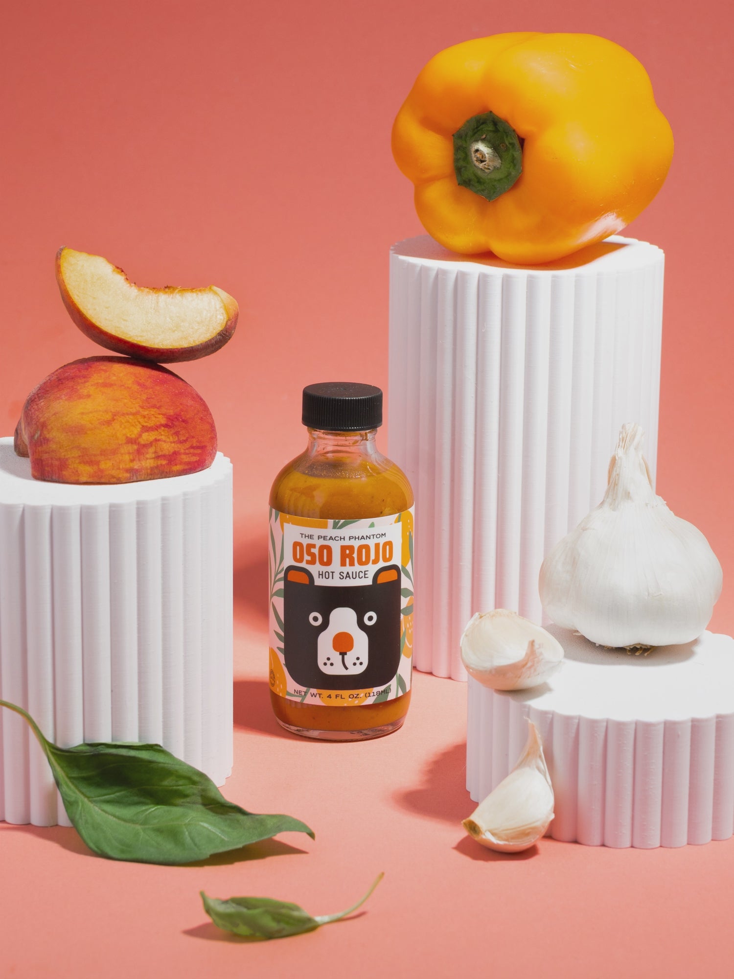 Oso Rojo Hot sauce with ingredients appearing in stop motion